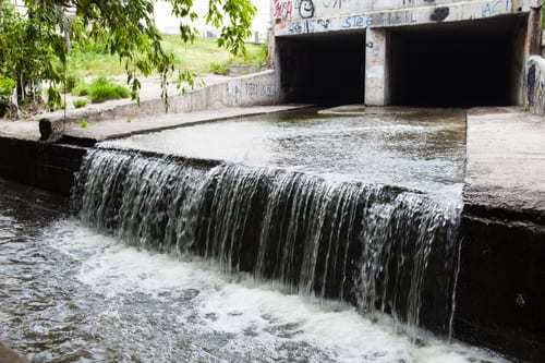 Water stream flowing out of an underground tunnel