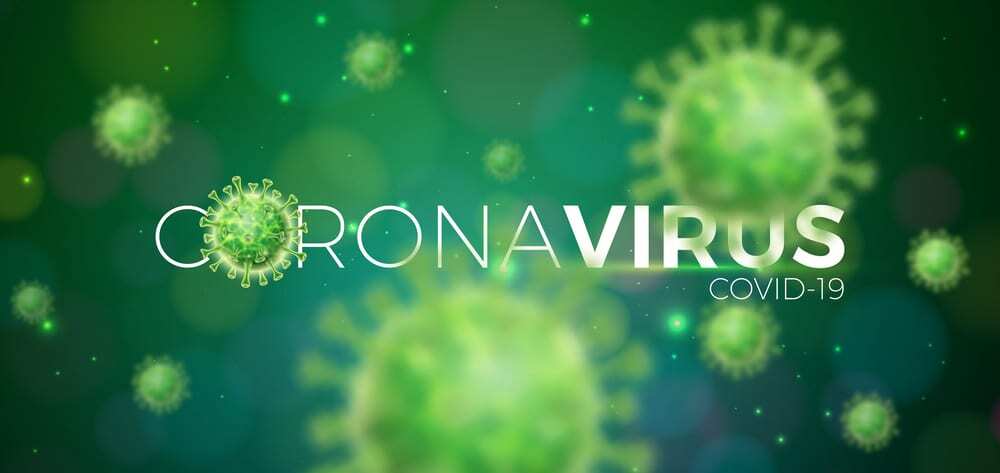 Text reading "Coronavirus COVID-19" on green background, virus cells floating thorughout