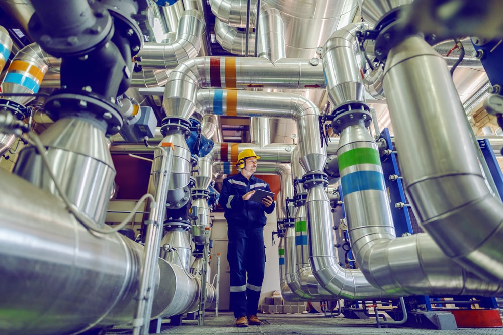 Worker conducting pipe inspection