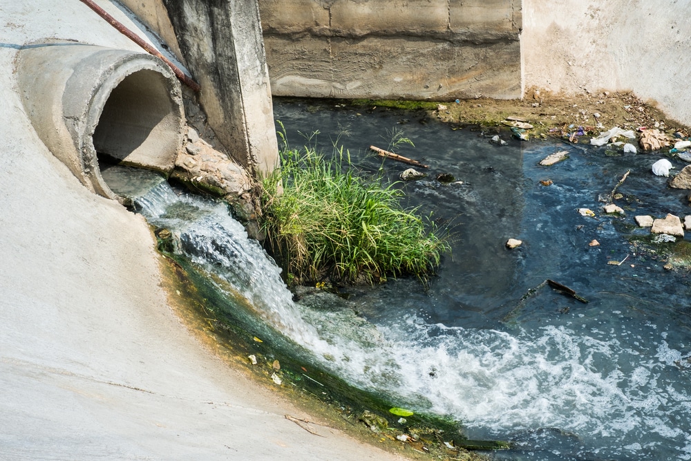 Wastewater draining from concrete pipe