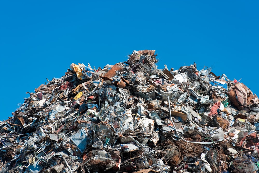 pile of scrap metal against blue sky